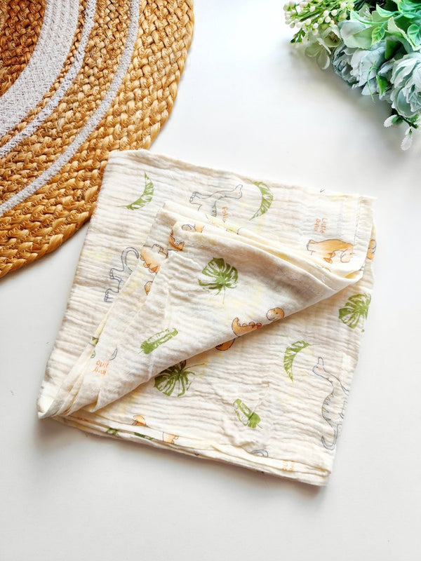 Crinkled Muslin Swaddle/Towel- Cream Dino & Tropical Leaves Print